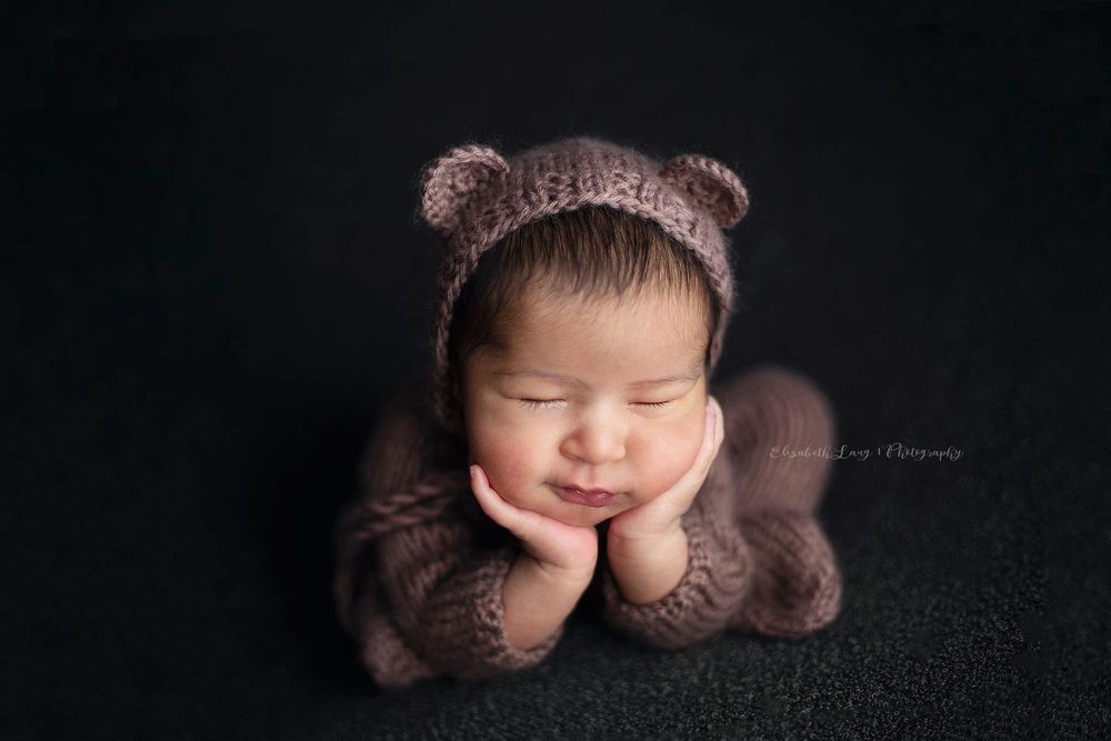 Newborn baby girl froggy pose from Elizabeth Lang Photography in Surrey.