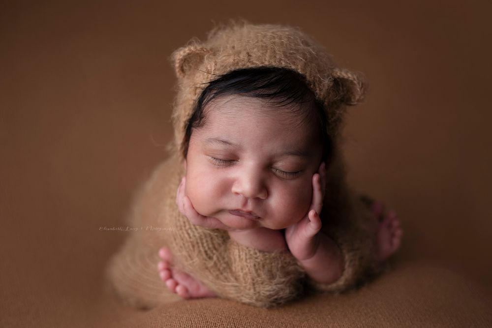 Newborn baby girl froggy pose from Elizabeth Lang Photography in Surrey.