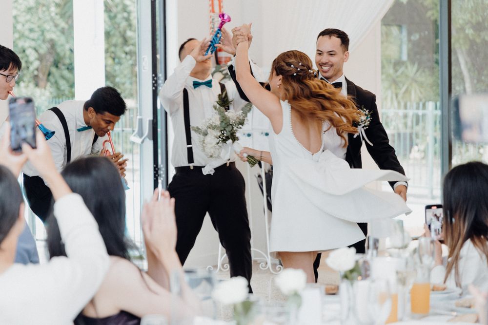 A joyful moment during a wedding celebration captured by Apertured Media Auckland Wedding Photographer.