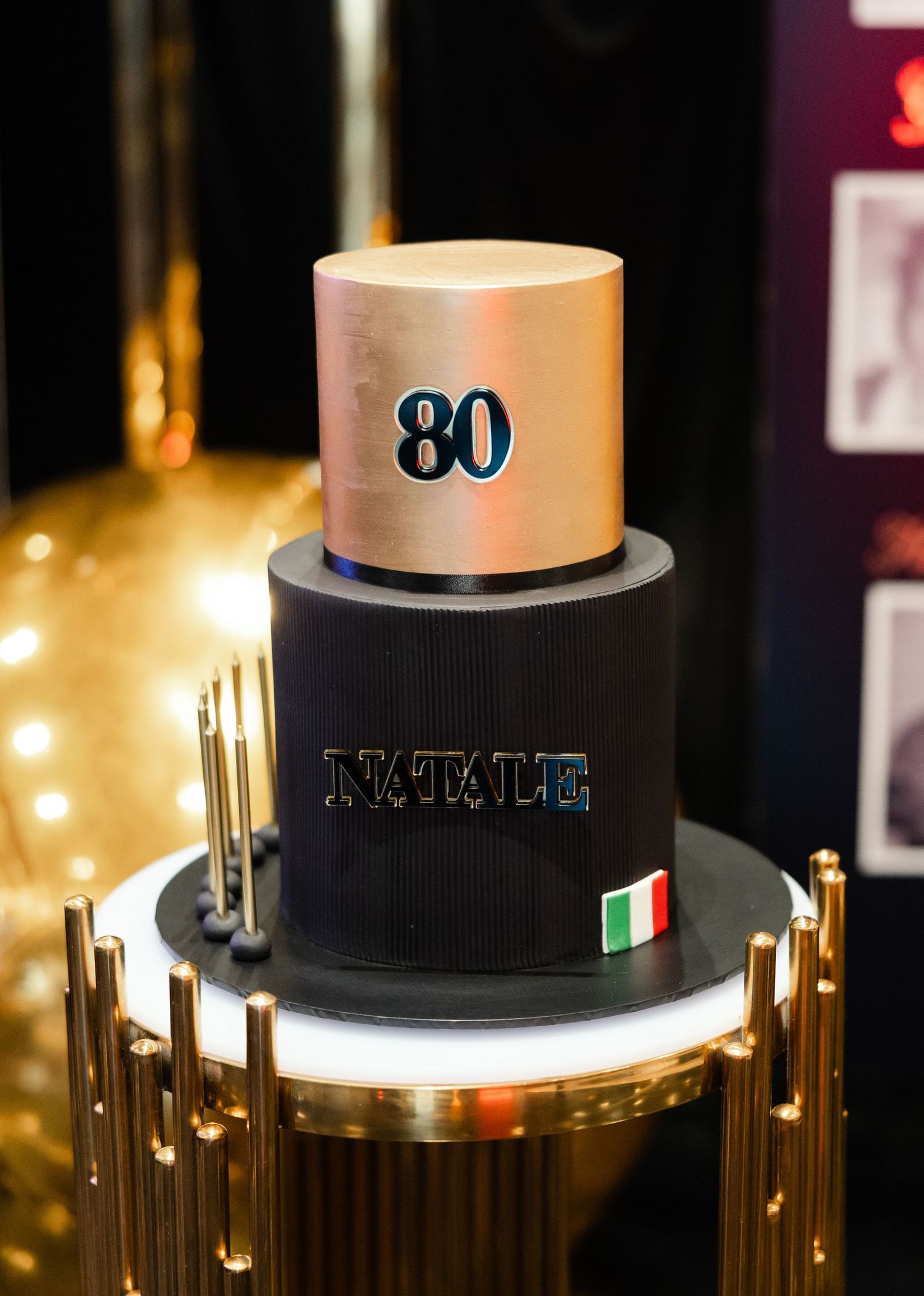 Illuminated modern light fixtures showcase sleek top-mounted cylindrical designs with Italian flag accents and metallic finishes.