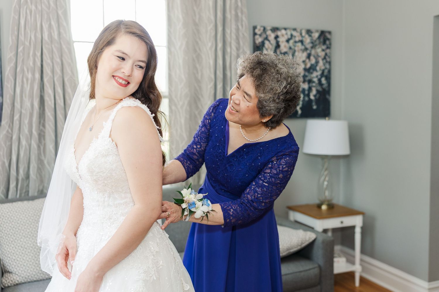 A series of candid moments between bridal party members in blue dresses and white gowns getting ready for a wedding.