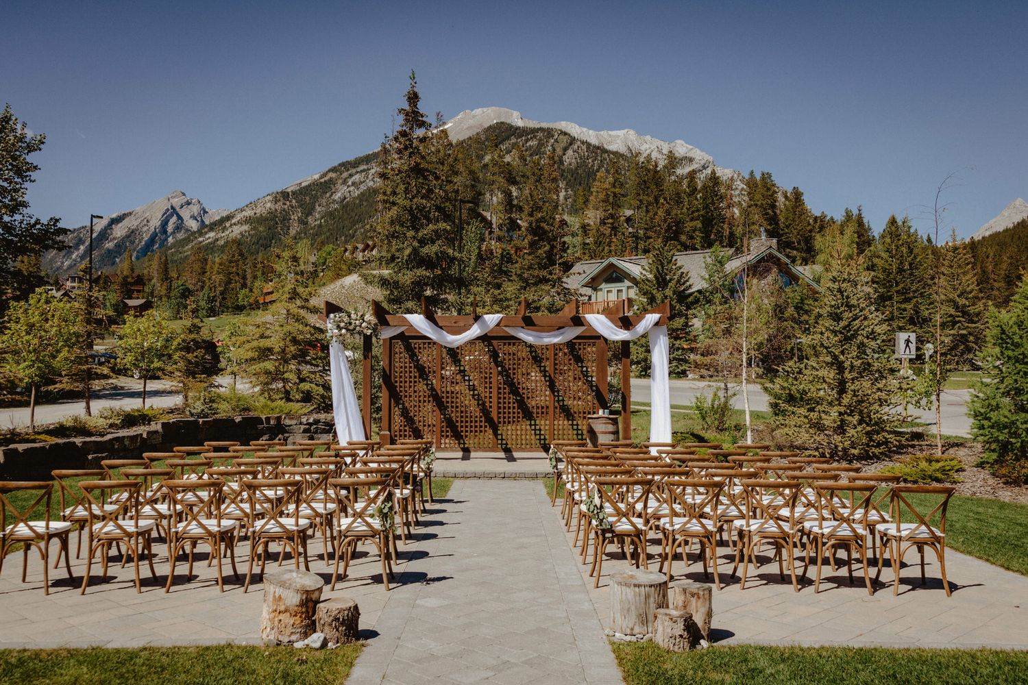 Canmore wedding ceremony at Creekside Villa with Rocky Mountain views, captured by Calgary wedding photographers.