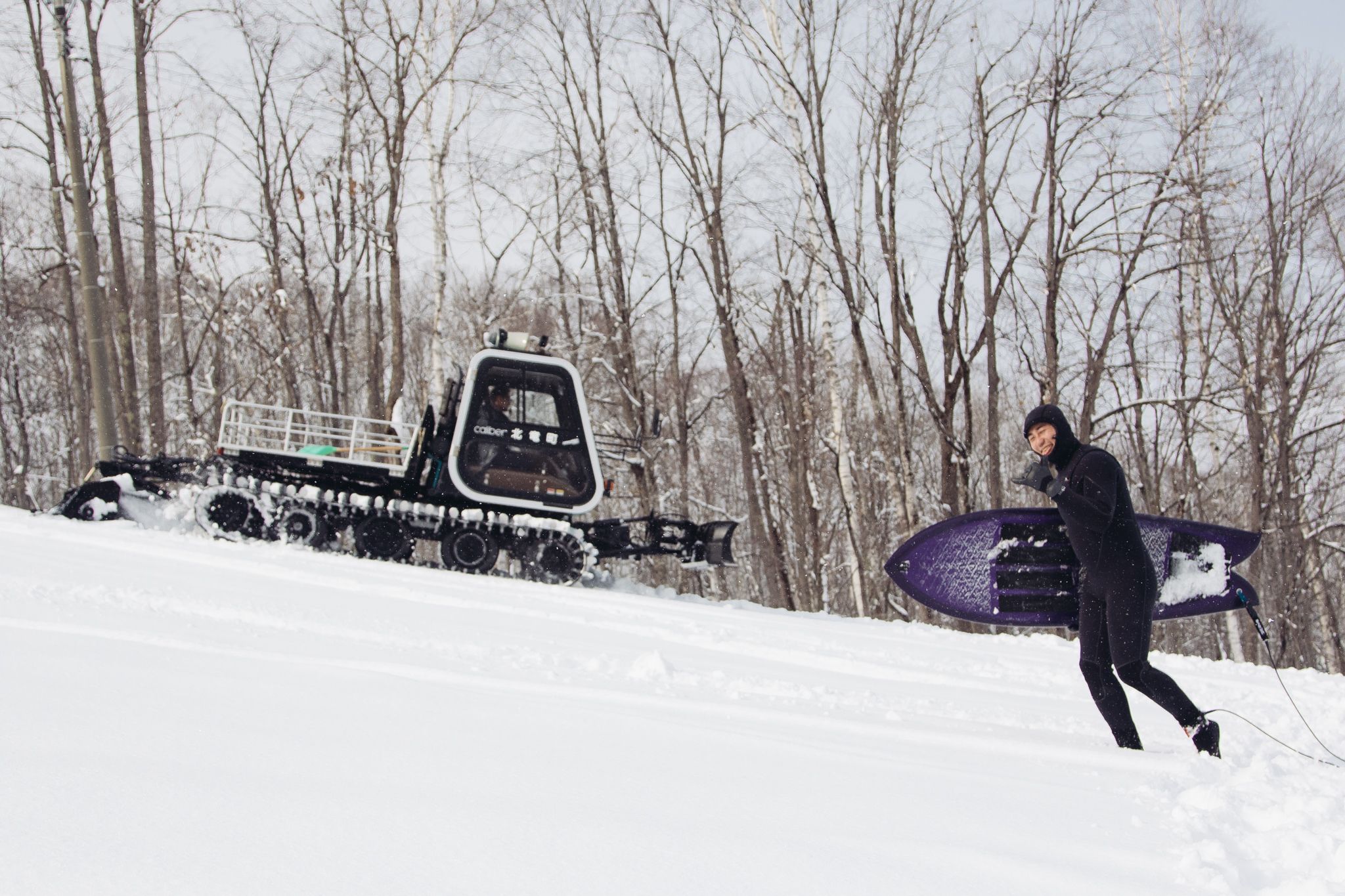 Hideki Yamanaka-san is a local surfer who showed us the surf culture in hokkaido Japan. He shakas infront of a snowcat