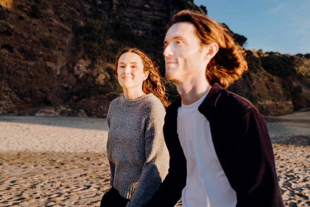 Loving couple for their engagement shoot in Piha with Apertured Media-Auckland Wedding and Elopement Photographer
