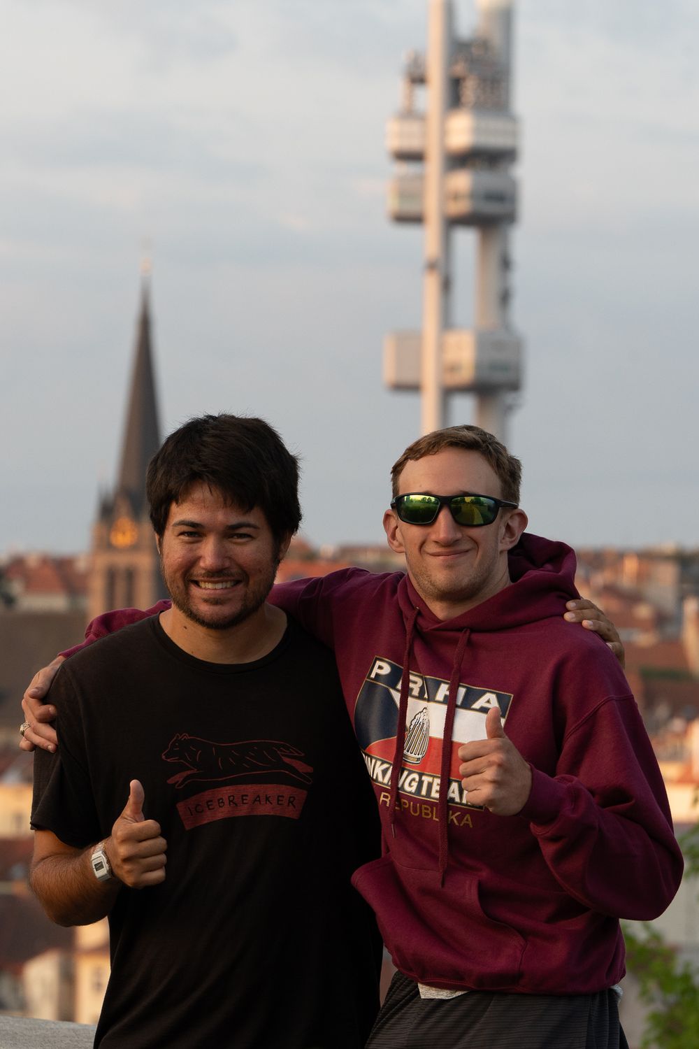 Friends in Prague posing for a photo in from of the baby tower.