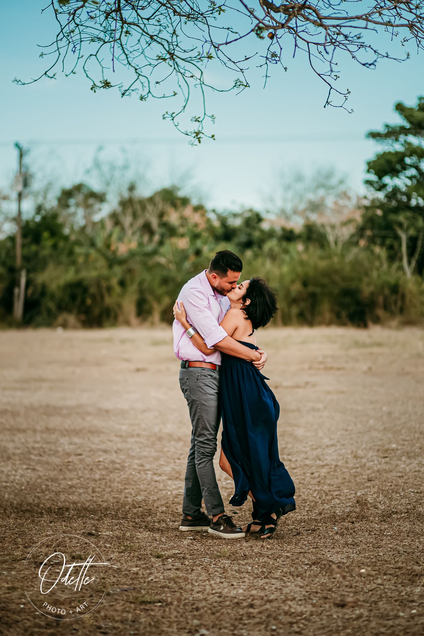 Couple kissing in the fields of Cuba