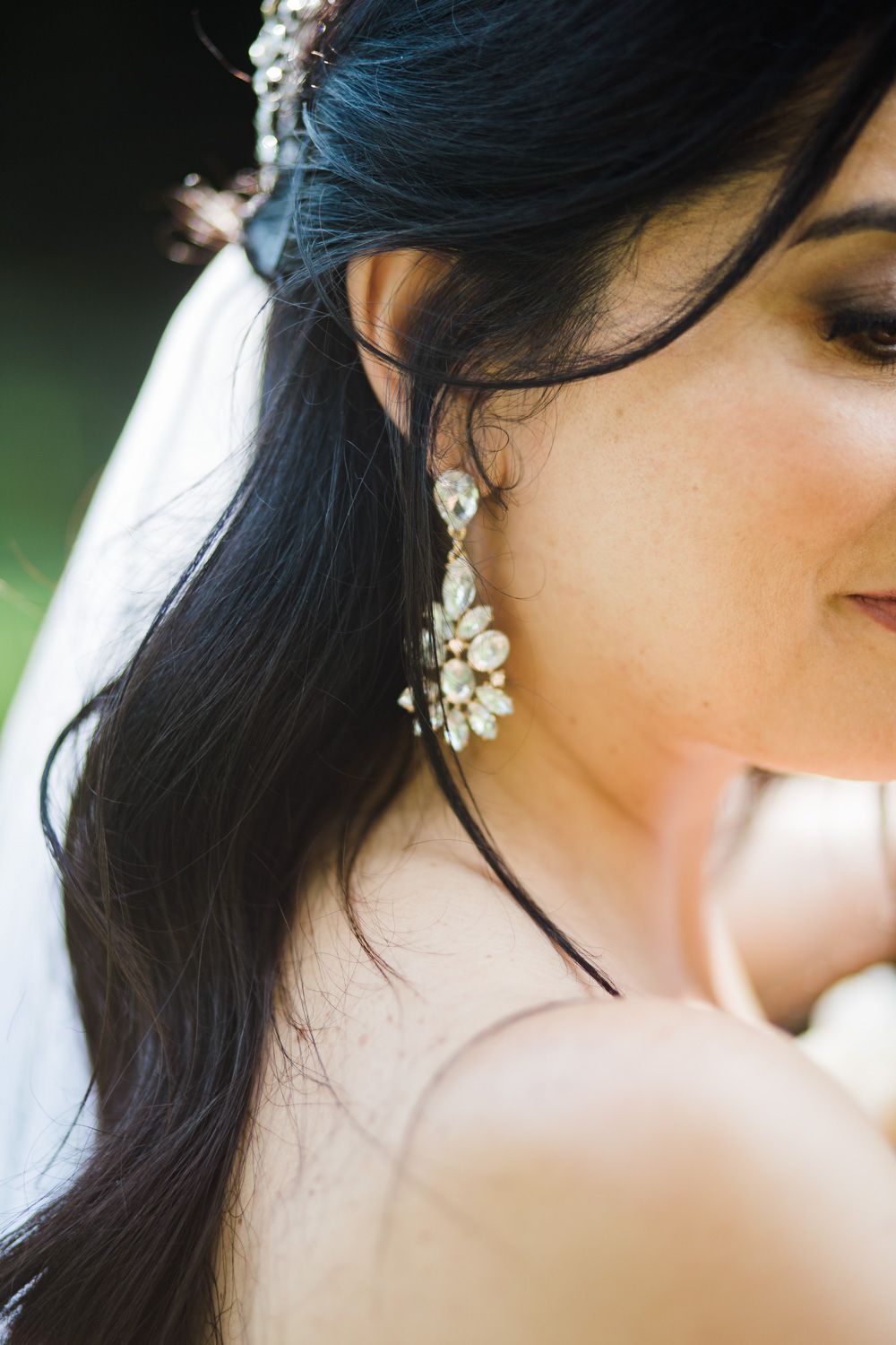 Closeup of bride wearing crystal earrings