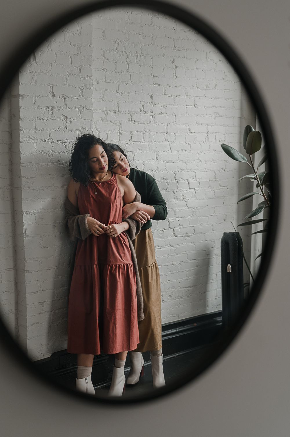 Campaign portrait by Tiffany Kelterer of 2 woman leaning against each other in Pioneer Square studio Seattle