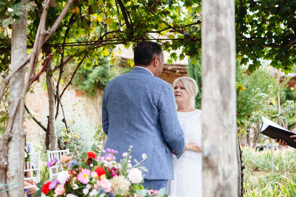 saying vows during a wedding in Tuscany
