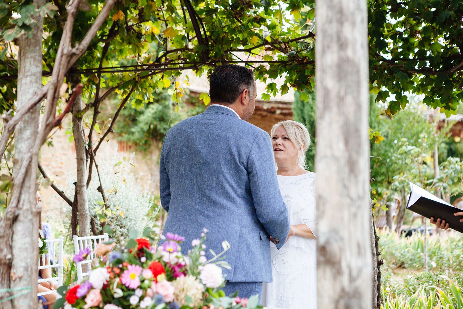 saying vows during a wedding in Tuscany