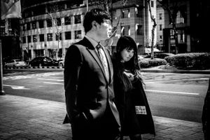 Black and white photo of young couple in street of Soul South Korea