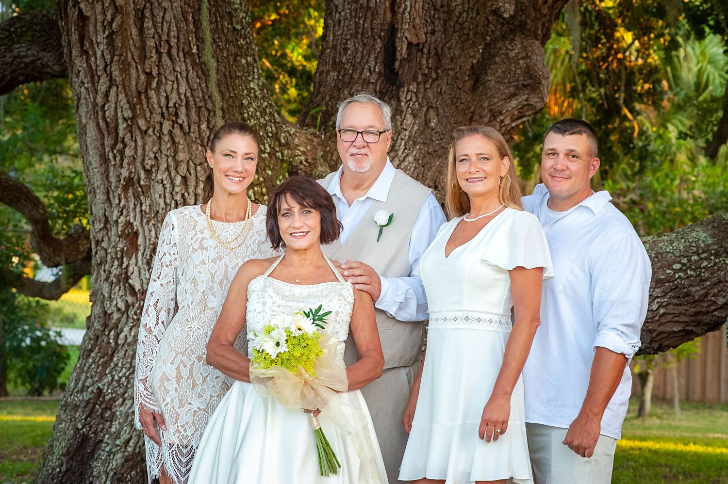 Parents pose with their children at vow renewal ceremony