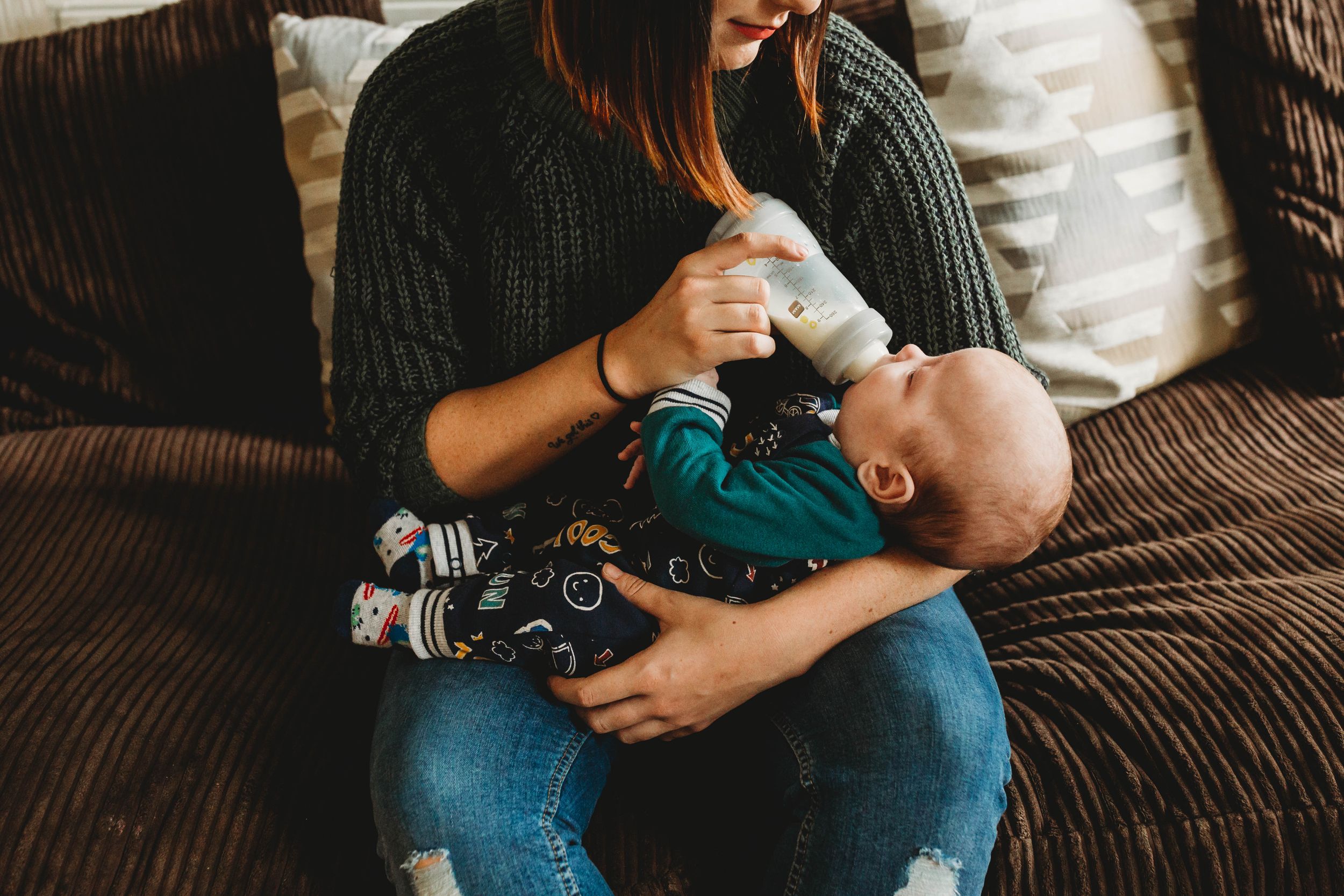 mum feeding baby bottle milk