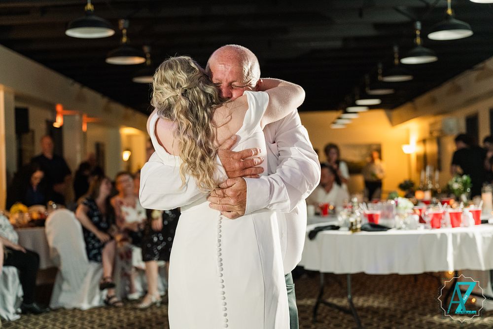 A romantic dance captured during a wedding celebration in an elegant reception venue.
