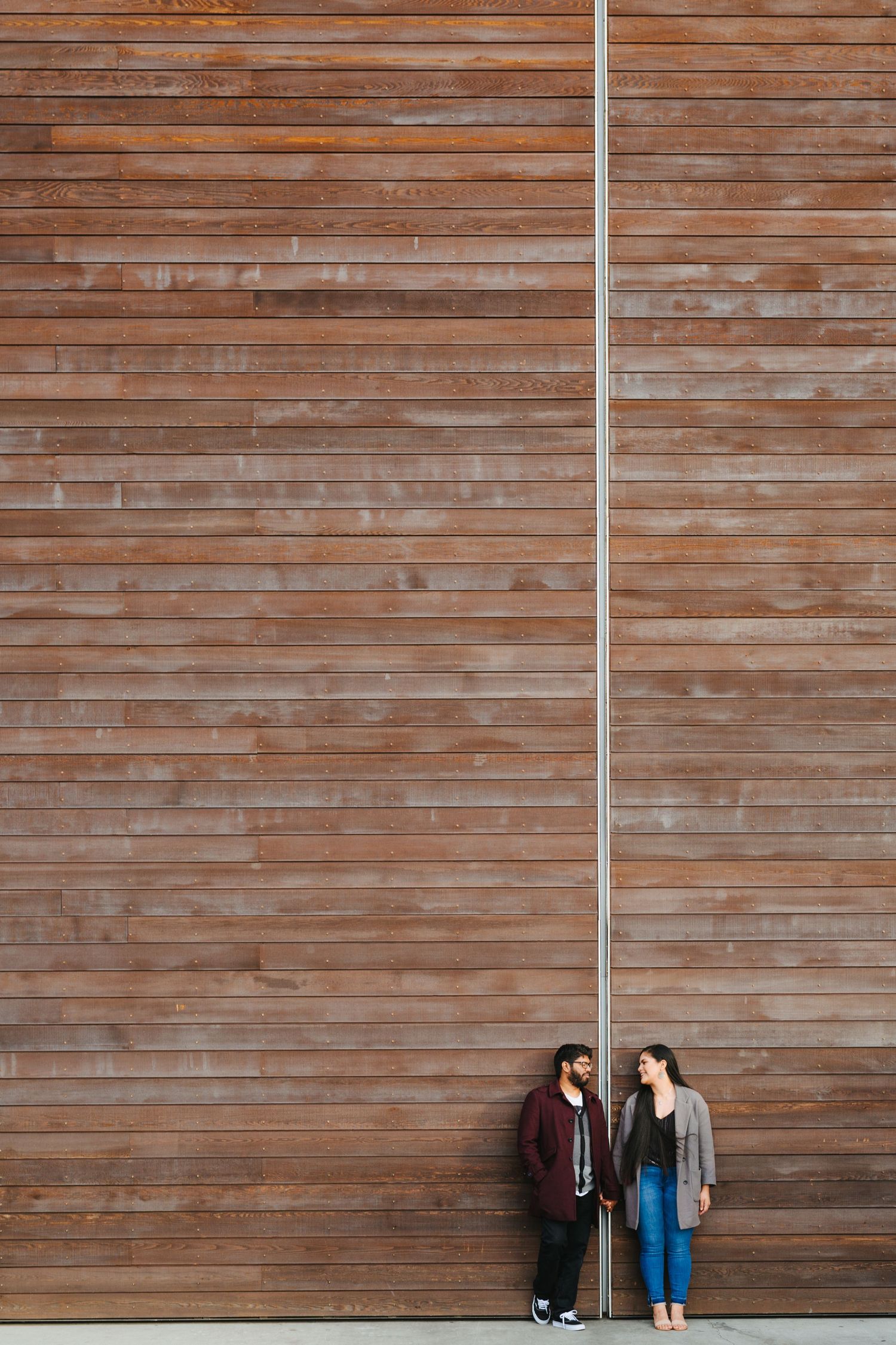 Couple session at Viaduct, Auckland in-front of industrial door, I love how the door create a symmetrical leading line