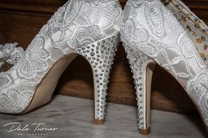 Close up of wedding shoes with diamanté's stuck on the heels.