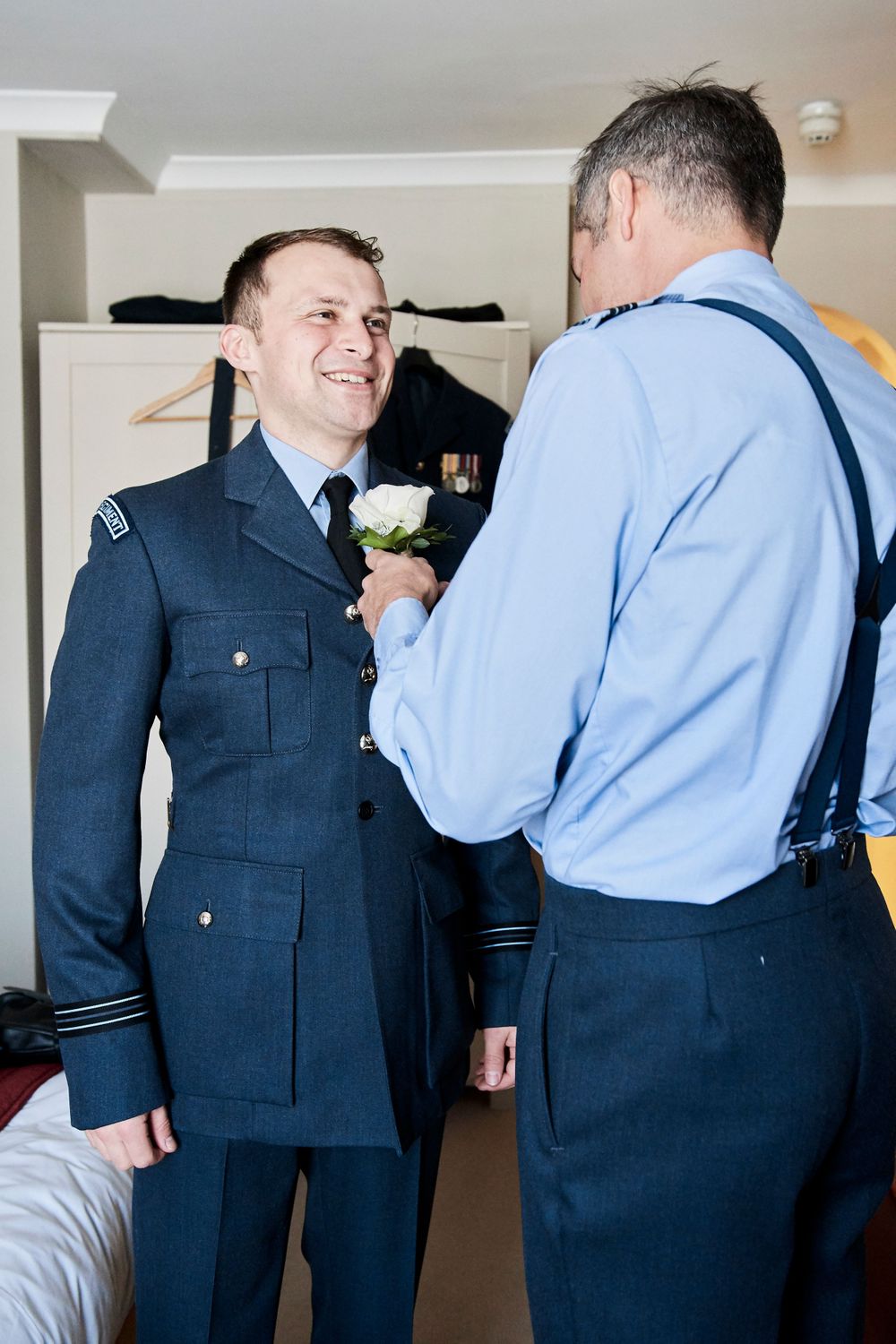 groom gets ready at The Angel, Suffolk. by Suffolk wedding photographer Faye Amare