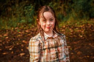 Muddy girl after puddle play in Melbourne