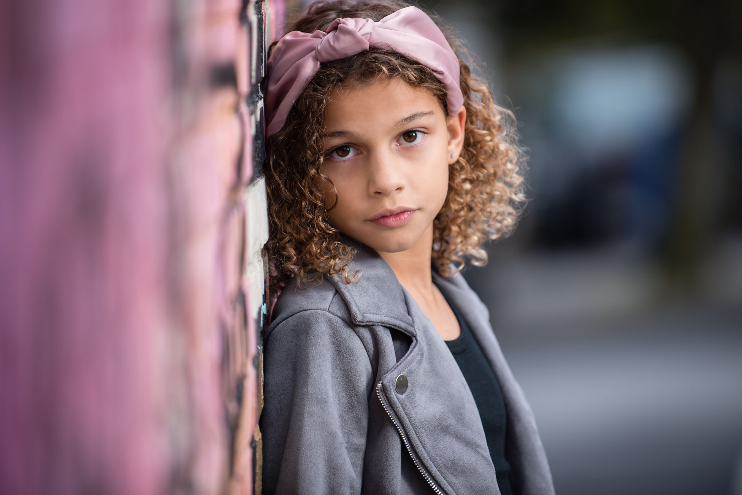 tween female model wearing pink headband