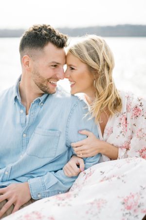 Light and airy film lakeside dock engagement session at Gray's Lake in Des Moines, Iowa