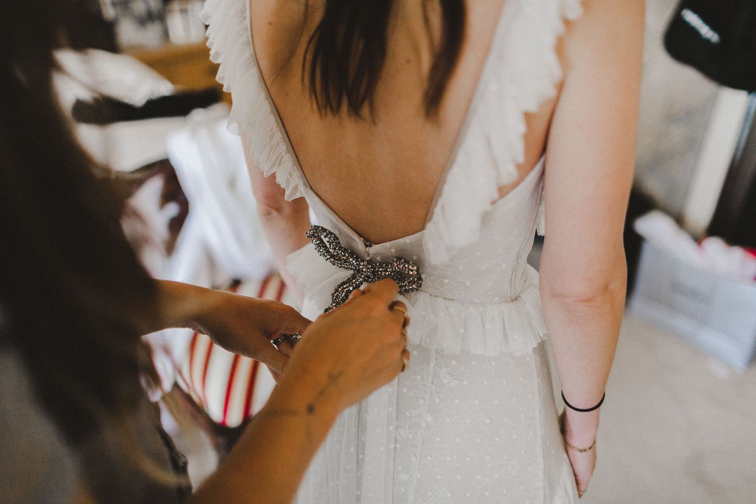 rear angle of bride's dress details with bow