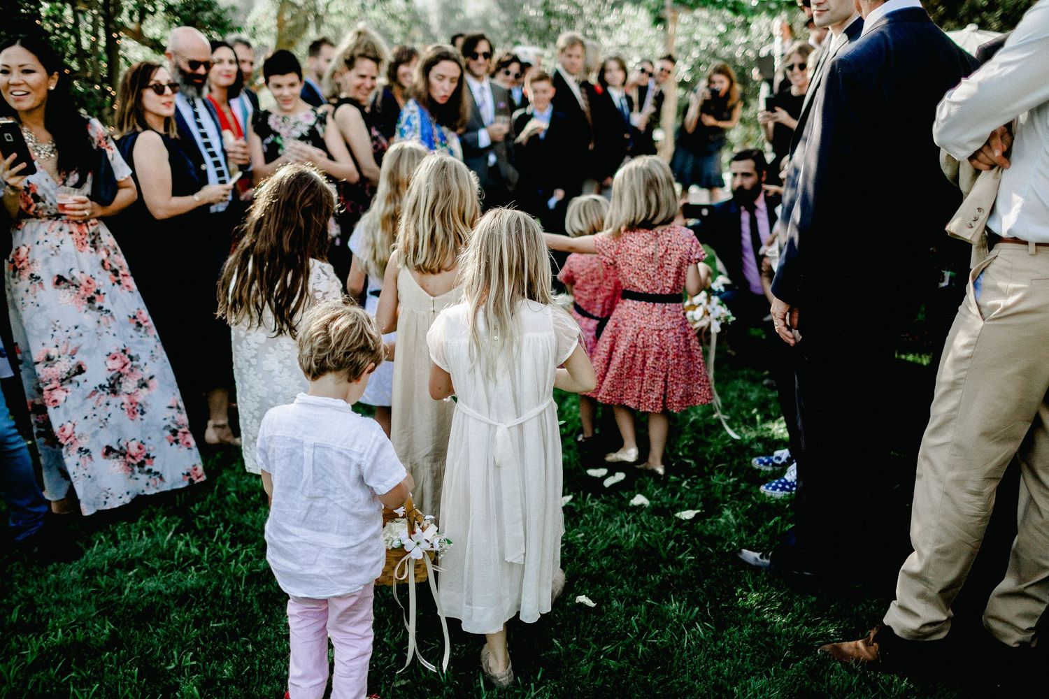 kids following bride down aisle