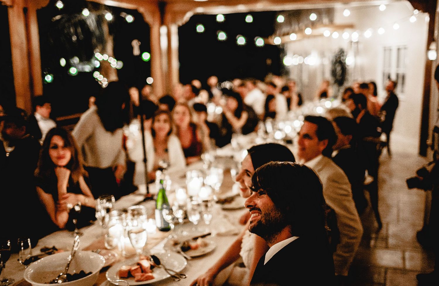 bride and groom enjoying reception with guests