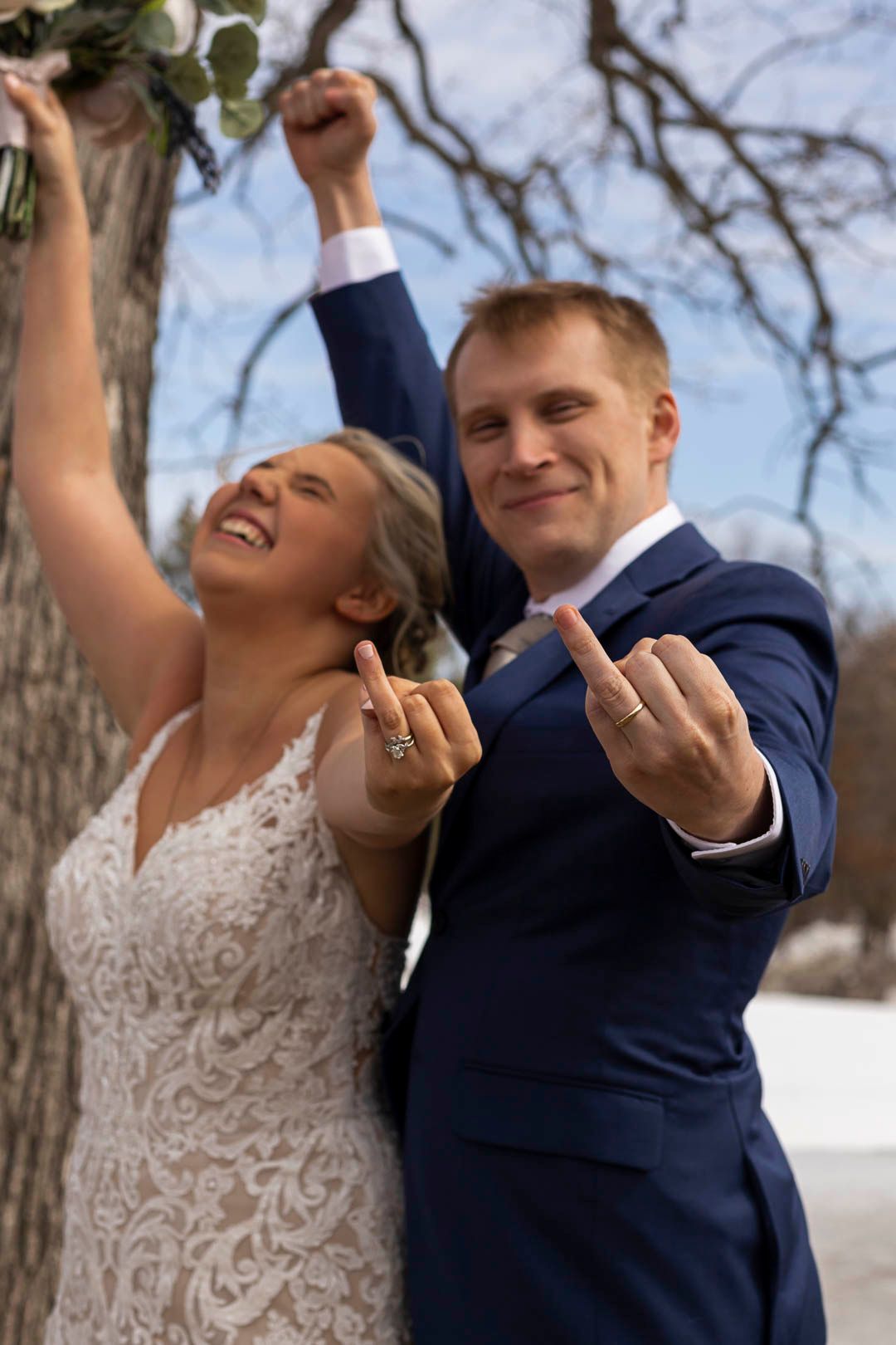 Minnesota Winter Wedding Couple outside showing off rings and smiling