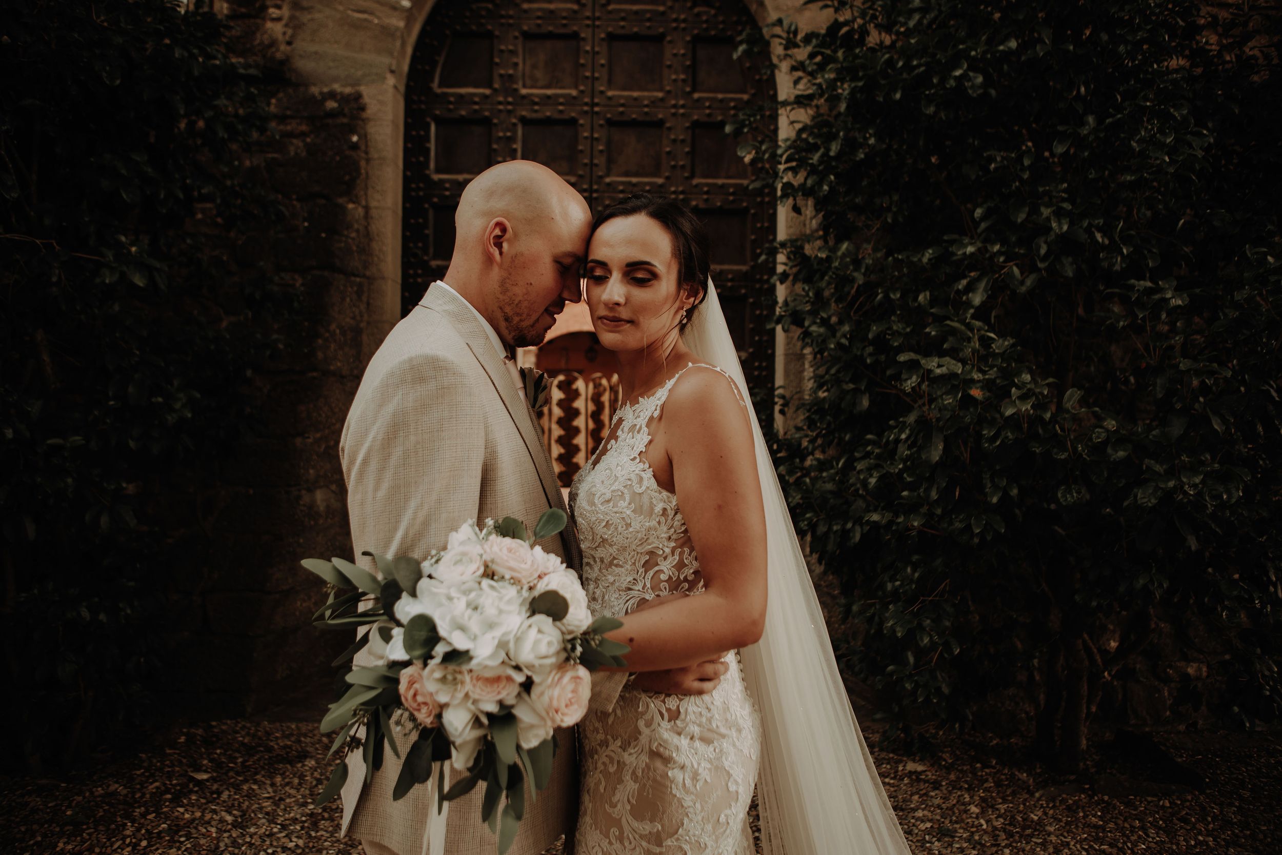 Bride and groom photograph outdoors at Castelo Il Palagio destination italian wedding in Tuscany