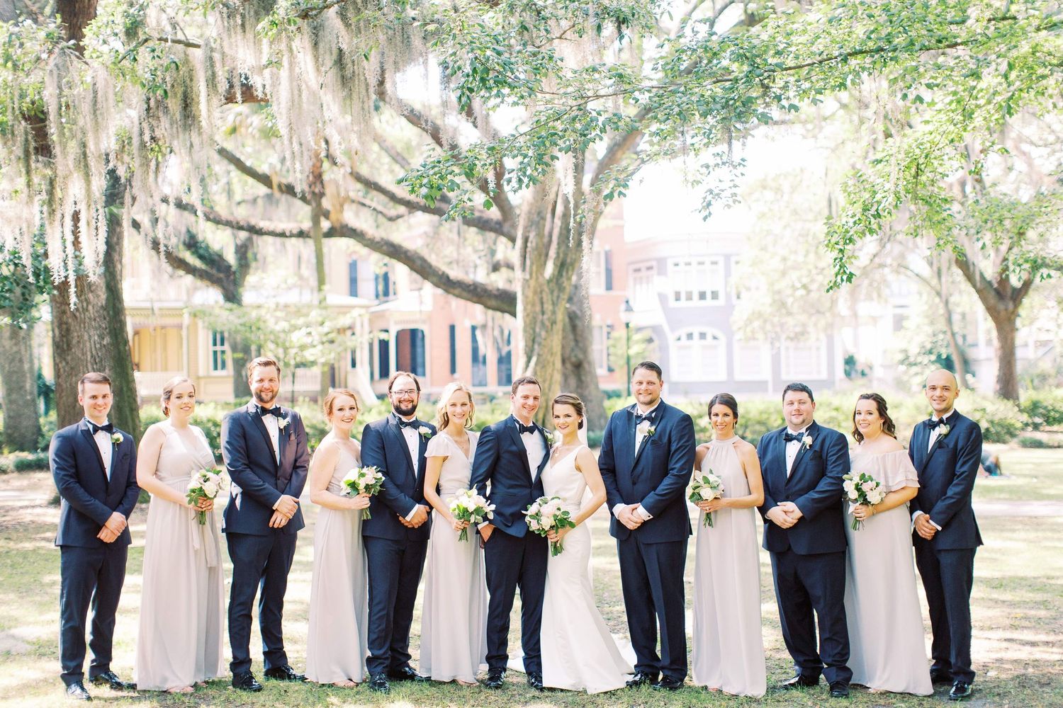 wedding party poses in forsyth park found in downtown savannah ga