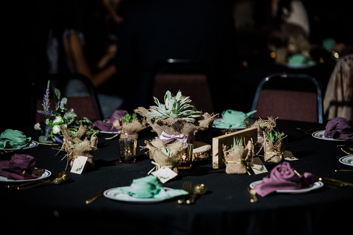 Wedding table setting of succulents with purple and green accents by Hudson Valley photographer