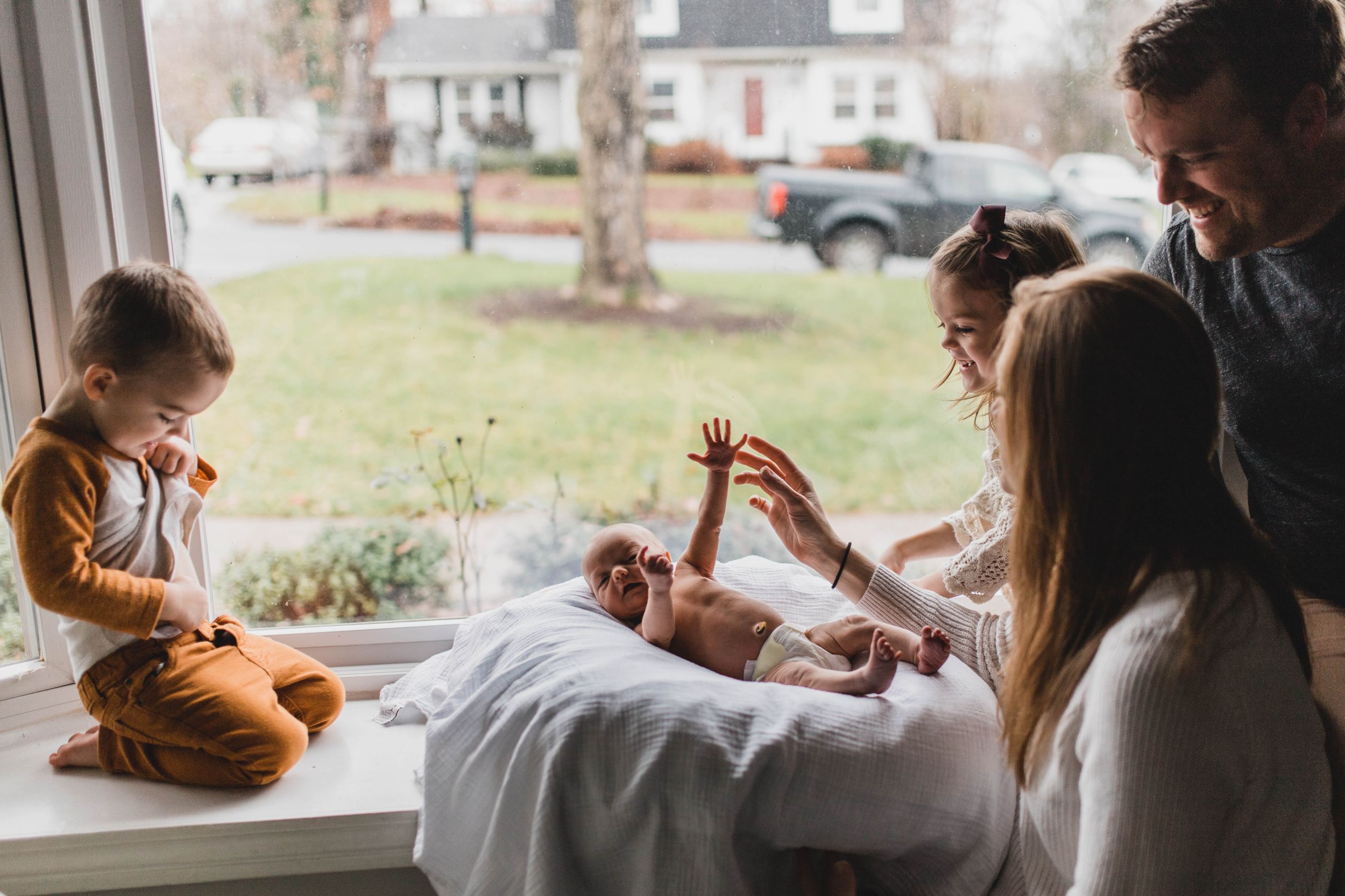 family during newborn shoot at home