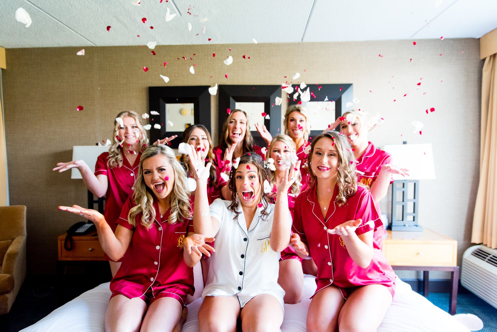 colorful chicago wedding photgraphy, red and white bridesmaids throw flower petals