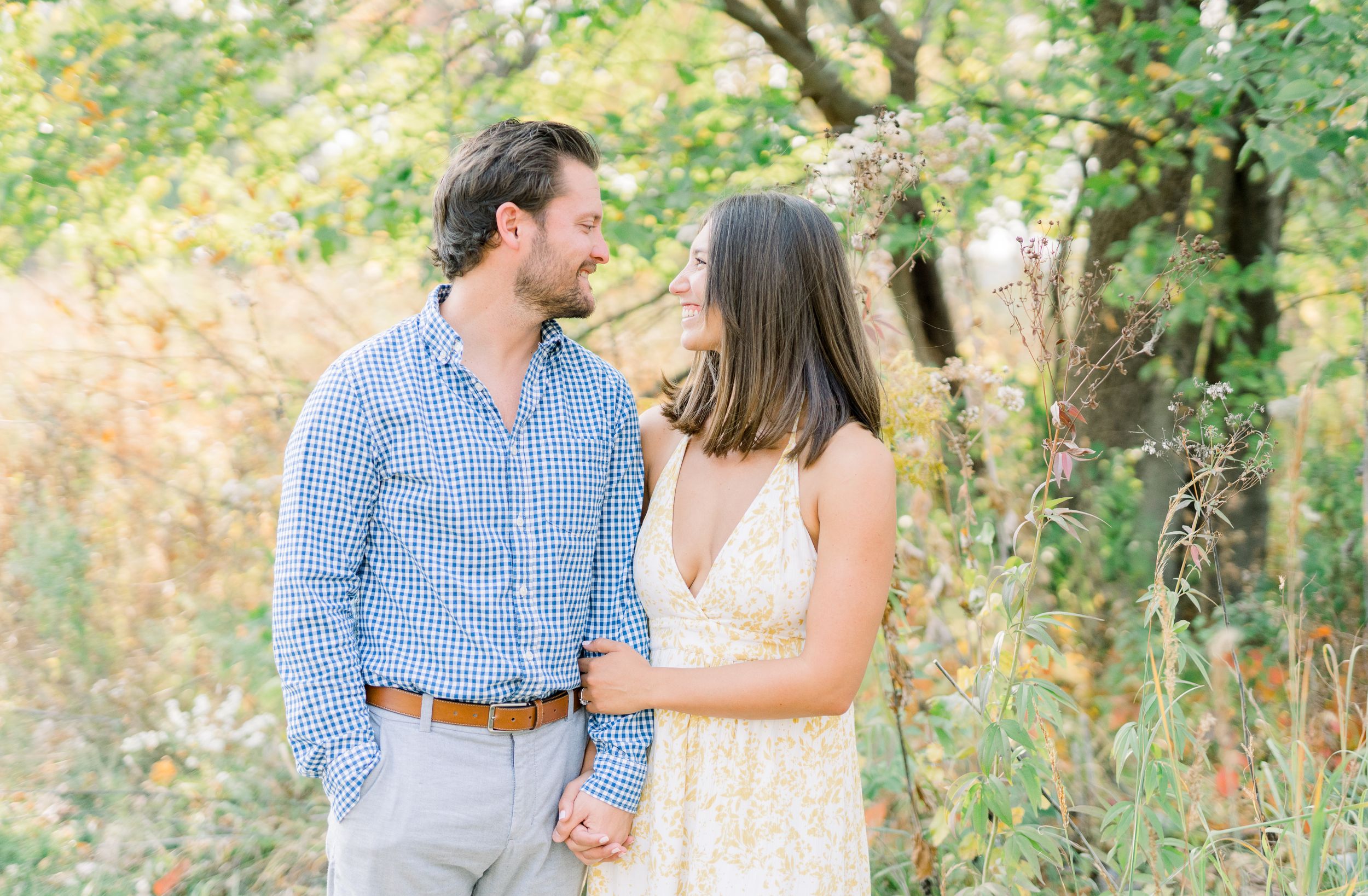 Des Moines Engagement photos at Grays Lake in downtown Des Moines, Iowa with light and airy photographer Nicole Laing
