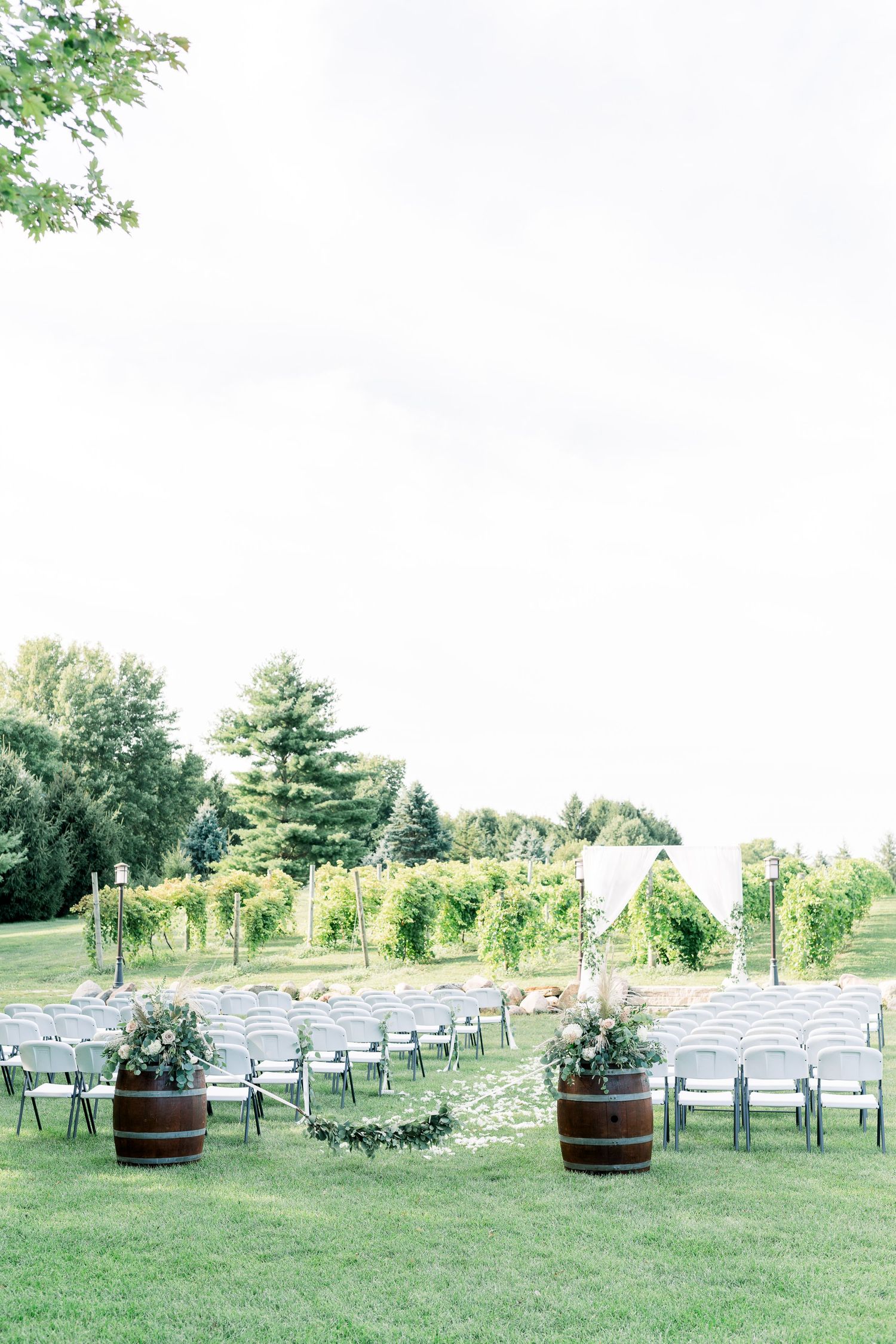 Vineyard photos with white willow events at Prairie Moon Winery wedding in Ames, Iowav