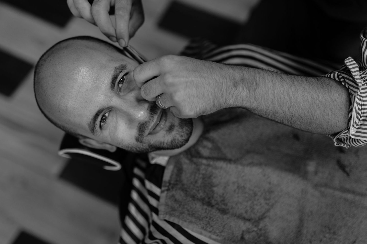 Black and white portrait in artistic style with soft lighting and shadows.