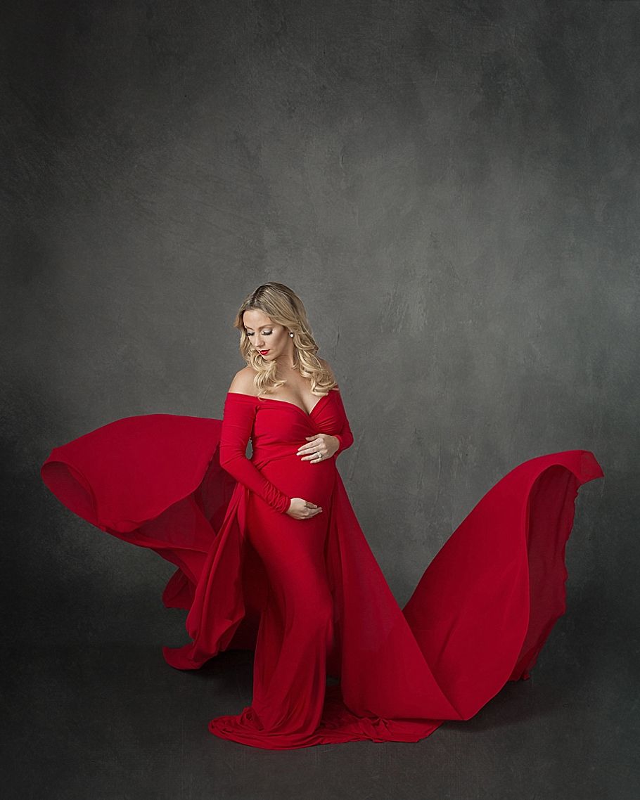 Austin Newborn Photography Maternity Portrait Modern maternity red dress studio gray background