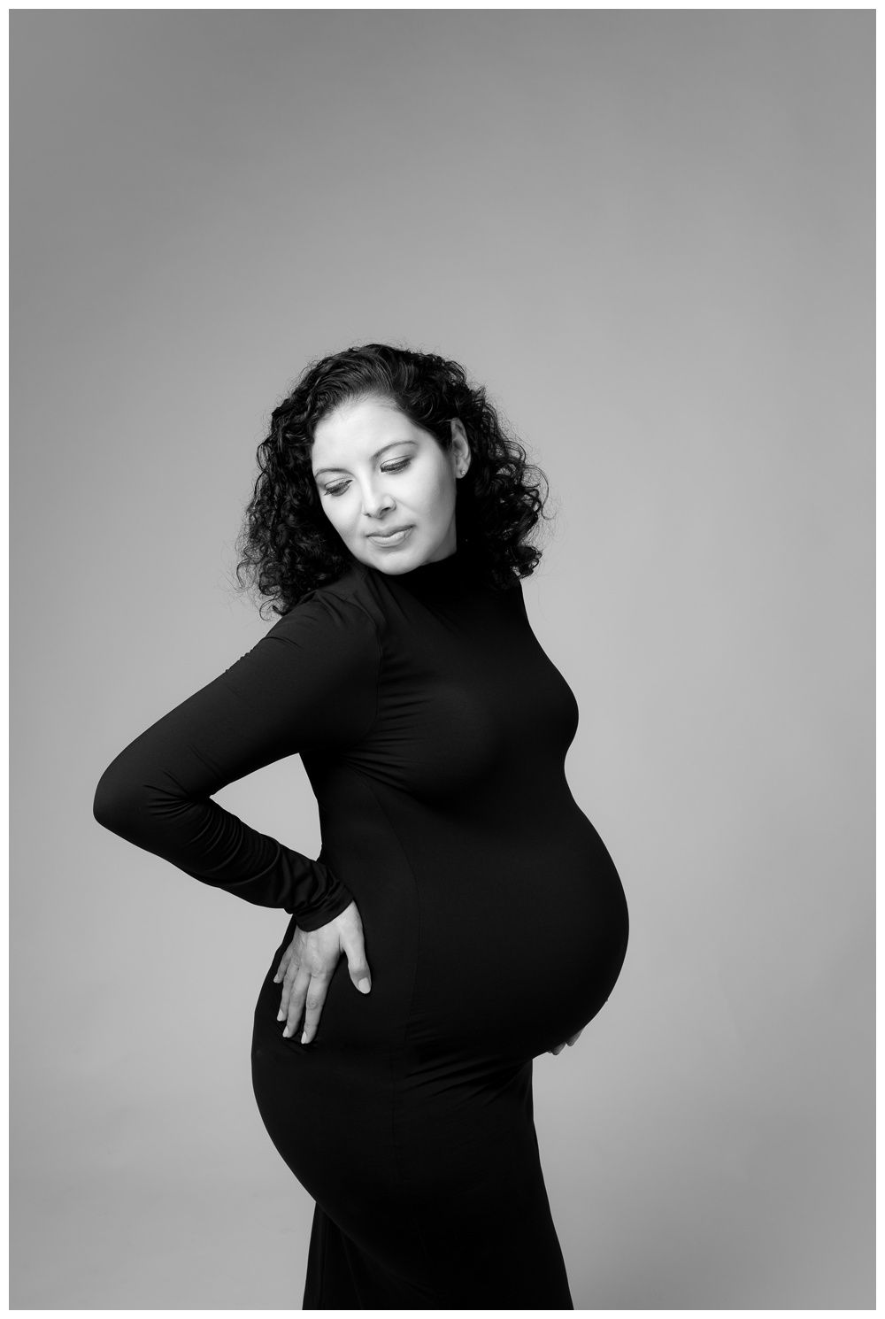 Austin Maternity Photographer modern motherhood portraits maternity portrait in bodycon dress black and white