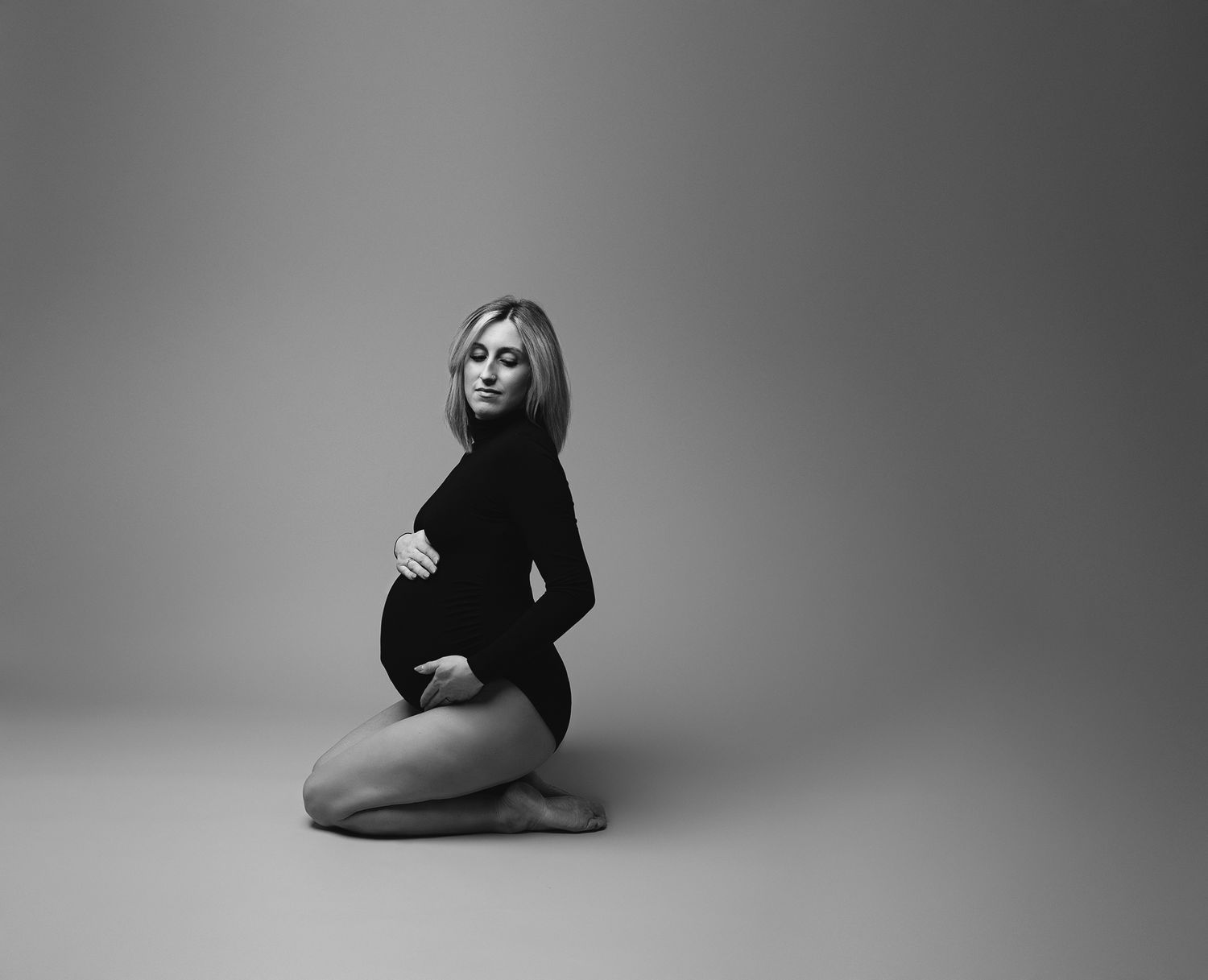 Black and white studio maternity session in Maine