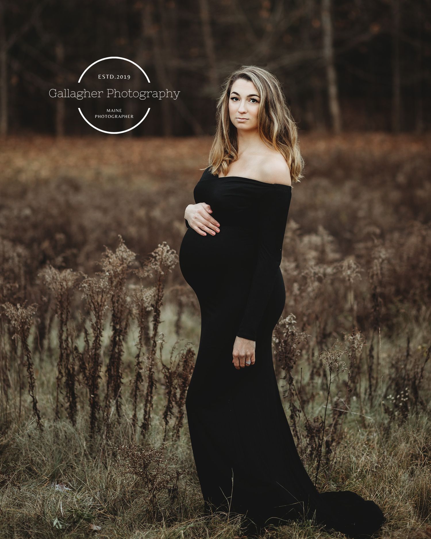 Professional outdoor beach maternity photo mother in black dress