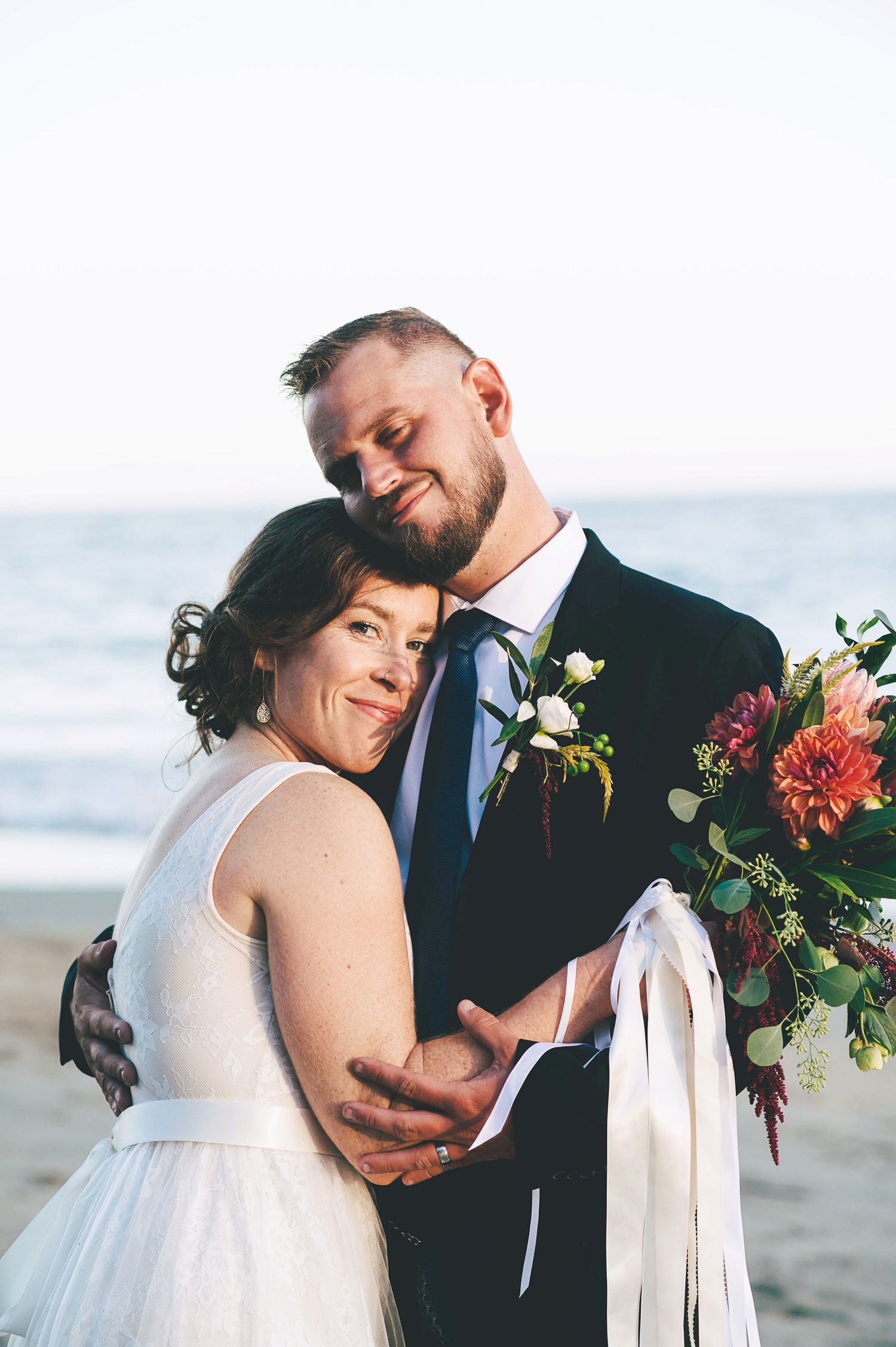 Newlyweds on the beach in Santa Cruz at sunset