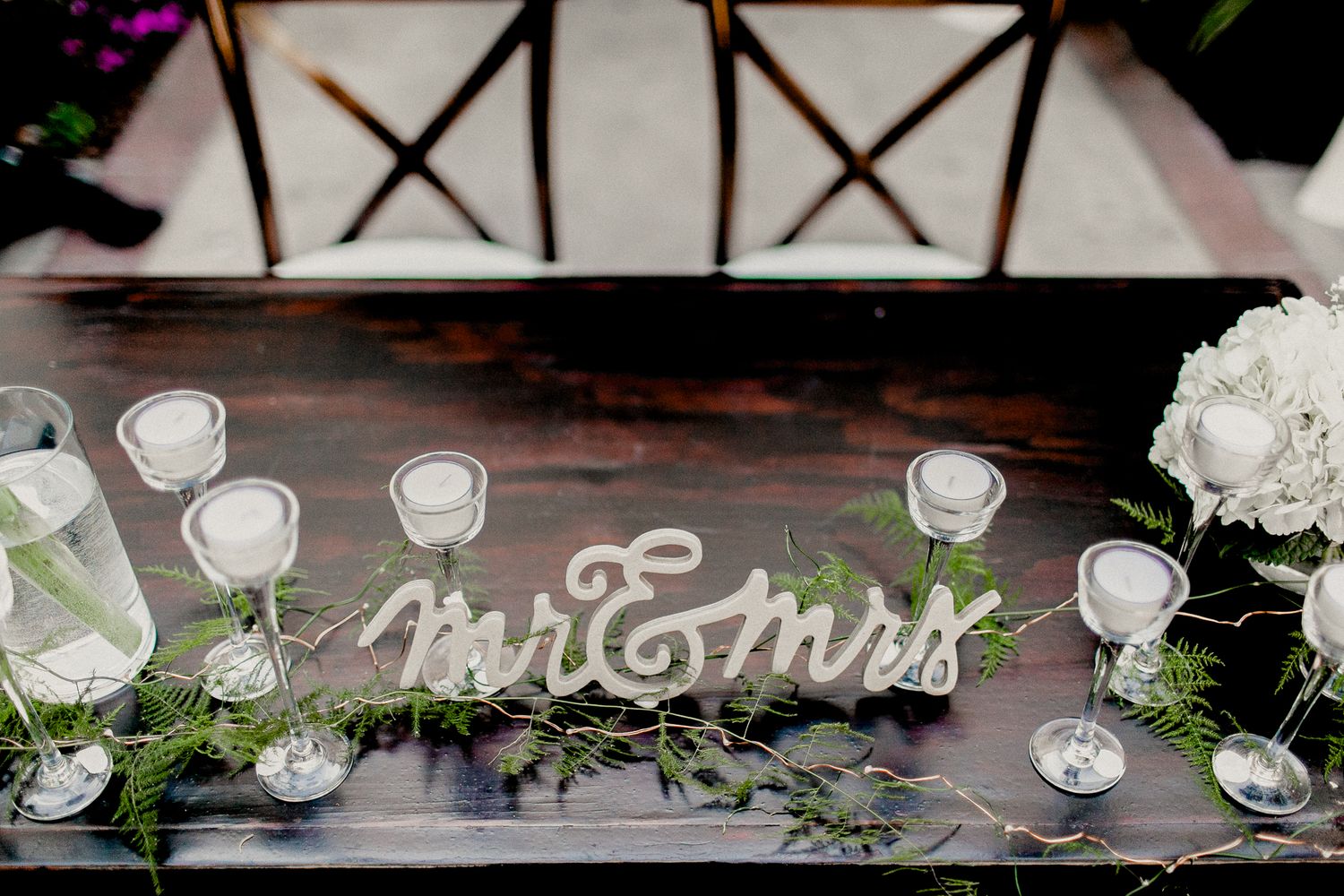 mr and mrs stand on sweetheart table