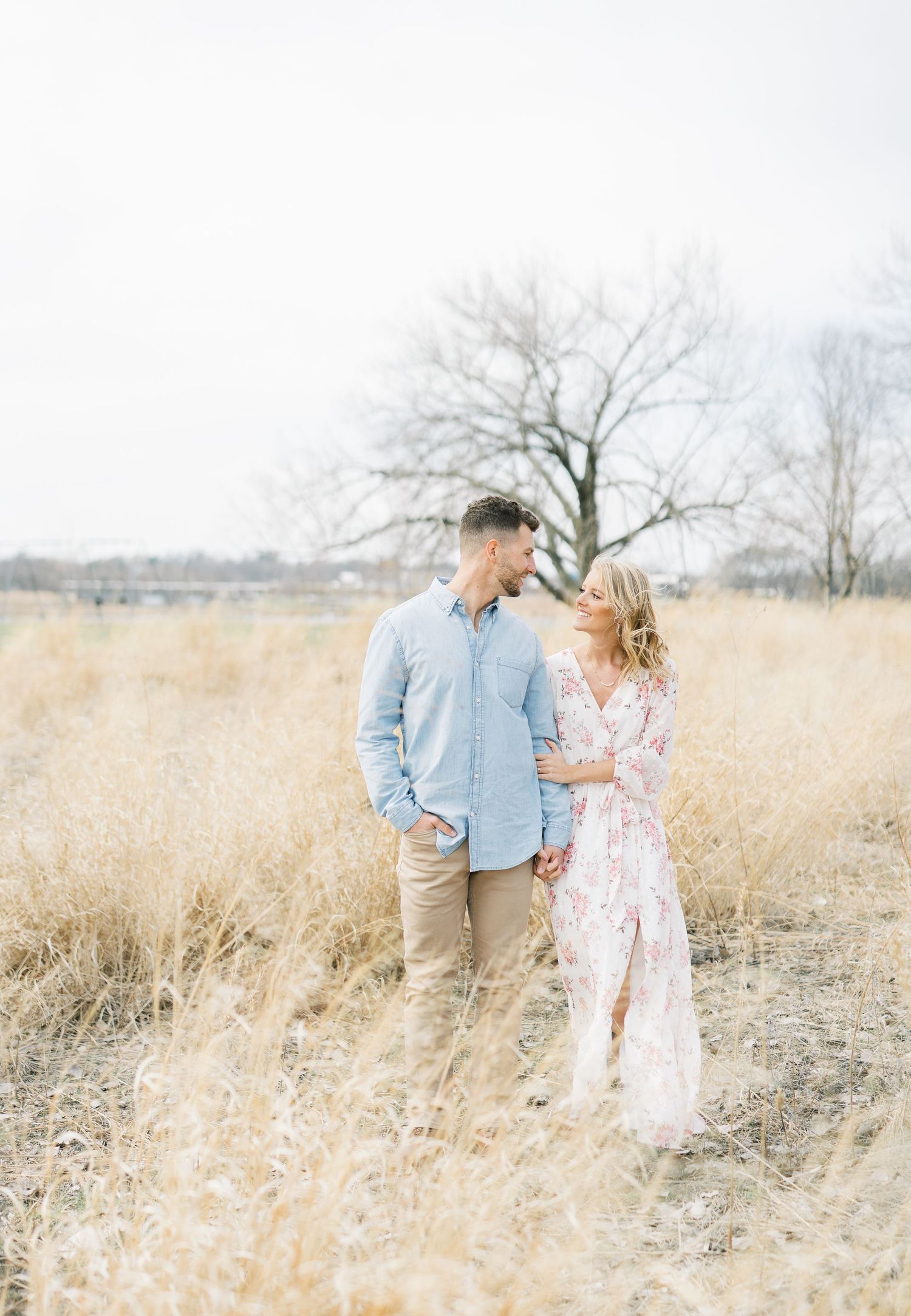 Light and airy film lakeside dock engagement session at Gray's Lake in Des Moines, Iowa