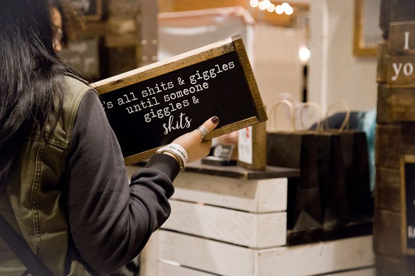 Pinology Puyallup Karter Designs woman purchasing sign