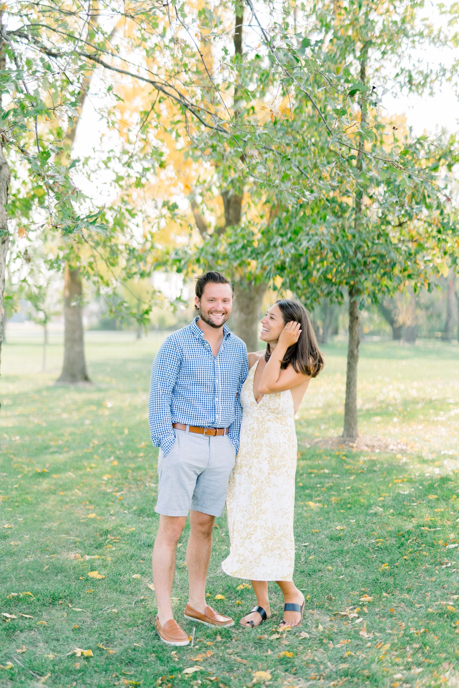 Des Moines Engagement photos at Grays Lake in downtown Des Moines, Iowa with light and airy photographer Nicole Laing