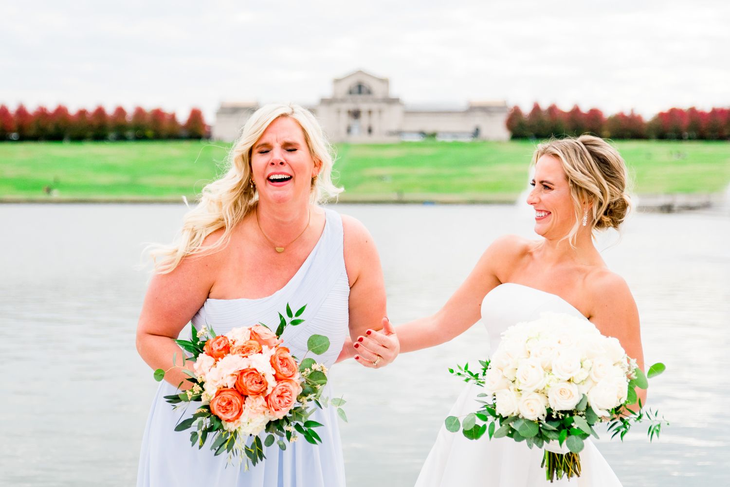 bride laughs and bridesmaid cries at fall wedding in Forest Park, STL