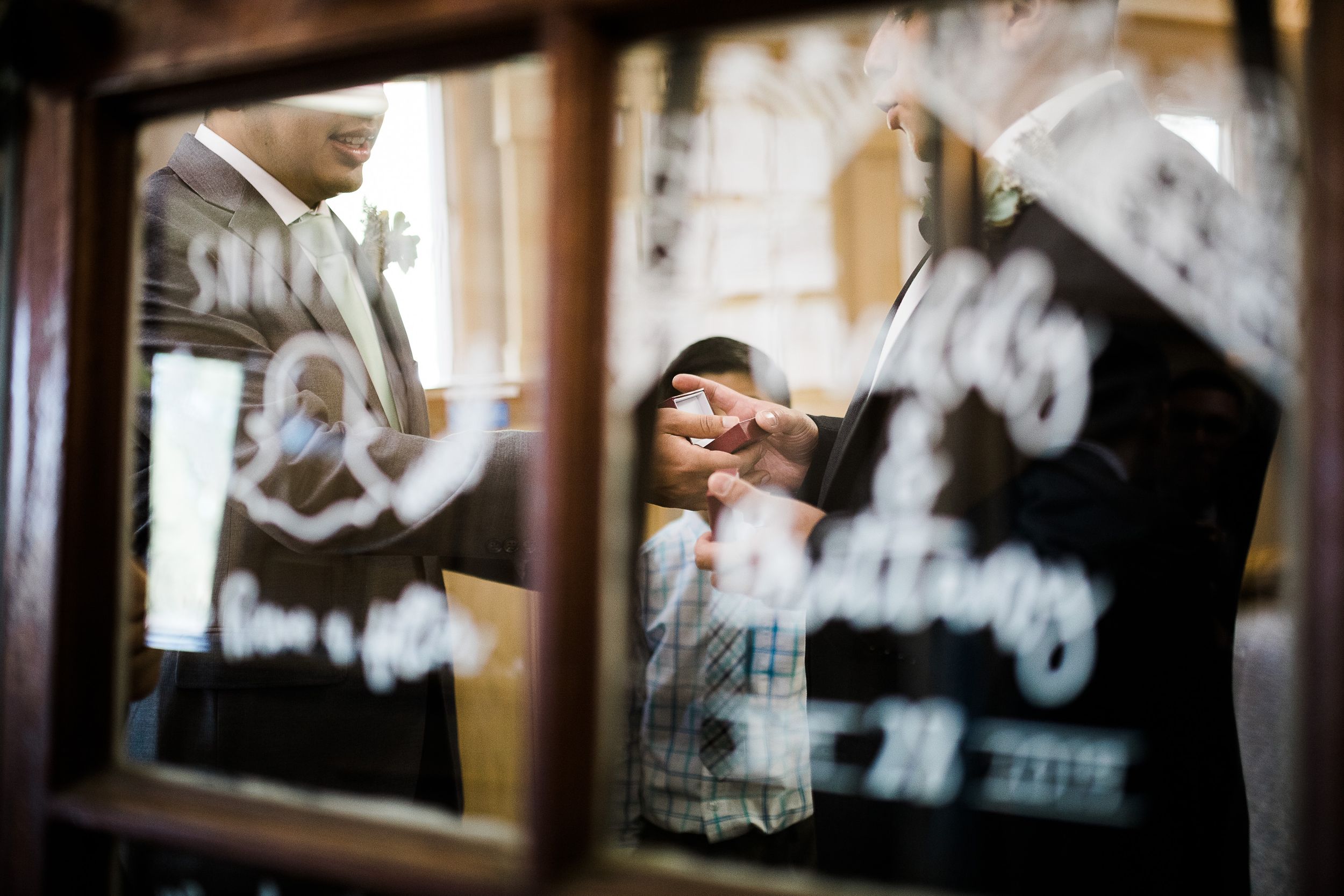 Rustic window pane wedding sign with groom holding wedding ring