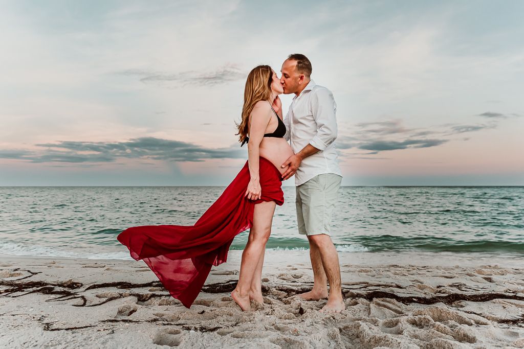 couple kissing on the beach
