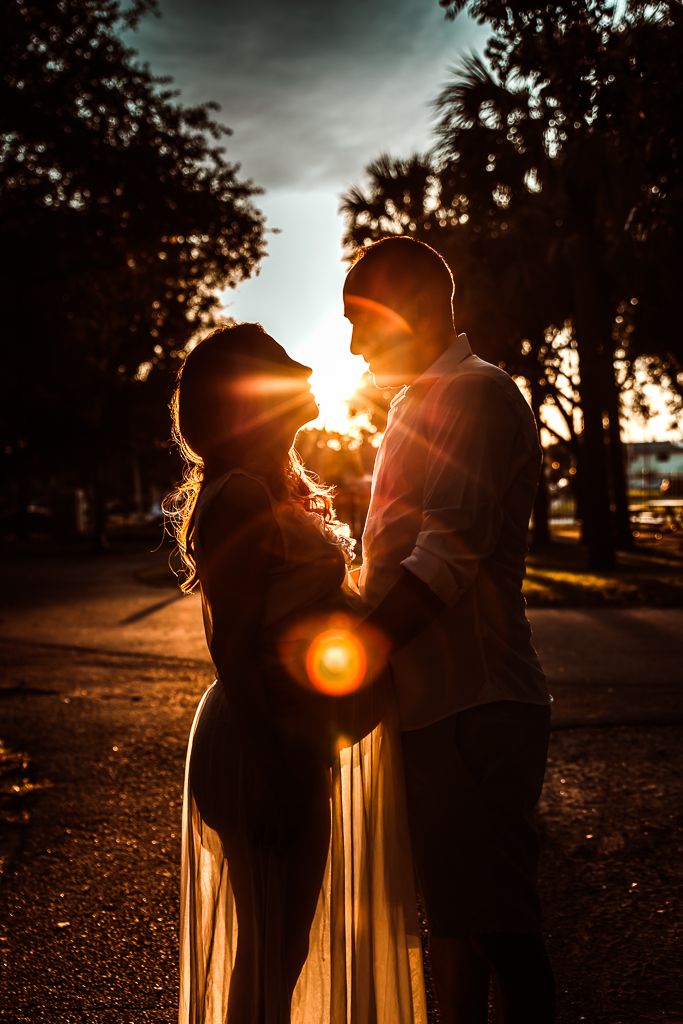 maternity photo with the sun shining on the future mother's belly