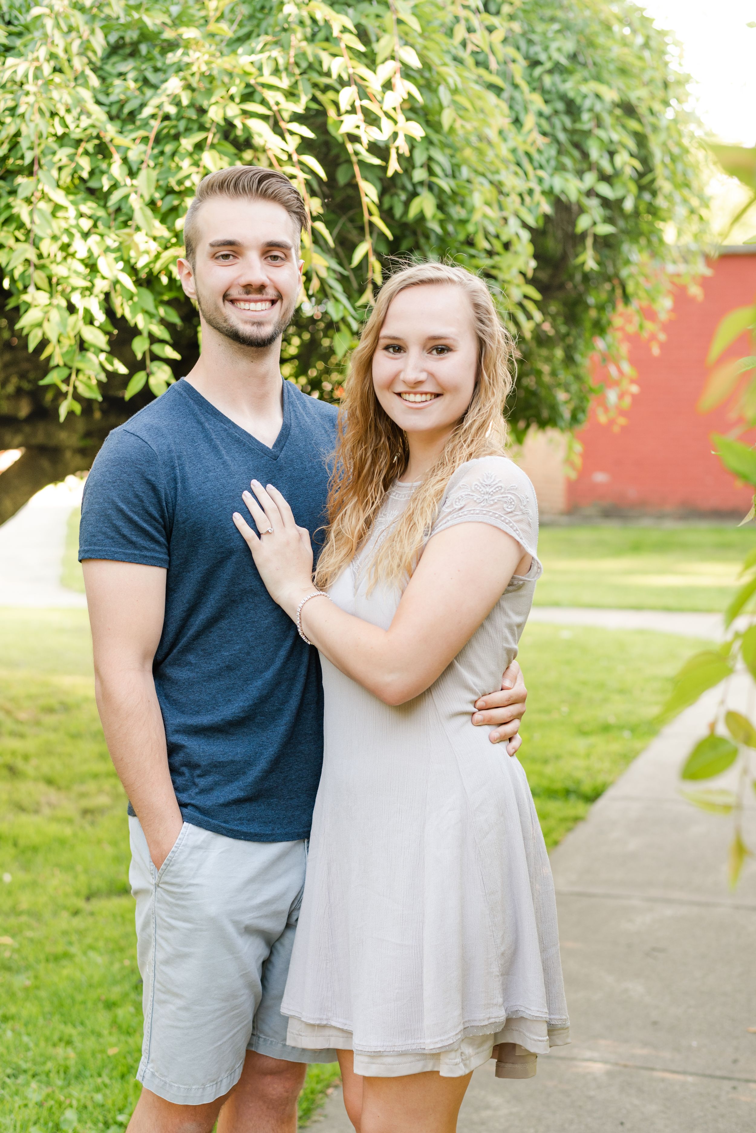 Couple smiling in park for engagement in Franklin Pennsylvania